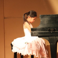 young girl Ivarett Y. playing Piano at 88 Keys Academy Arcadia spring recital