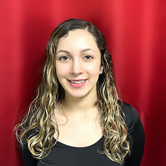 Image of Genesis Acosta, a teacher at 88 Keys Music Academy, with a red background.