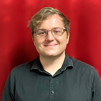 Image of Logan Cain a teacher at 88 Keys Music Academy, with a red background.